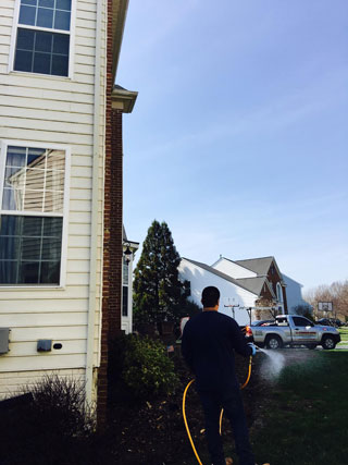 spreading pesticide outside